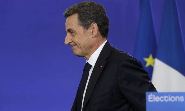 Nicolas Sarkozy, conservative UMP political party leader and former French president, attends a news conference after the close of polls in France's second round Departmental elections of local councillors at their party's headquarters in Paris