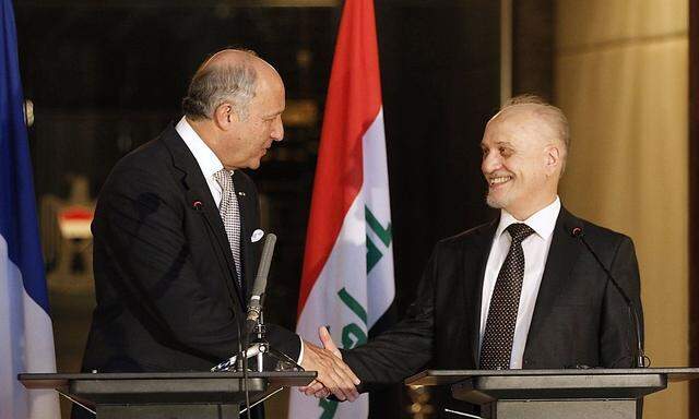 Frankreichs Außenminister Fabius (li.) traf in Bagdad auf Vizepremier al-Shahristani.
