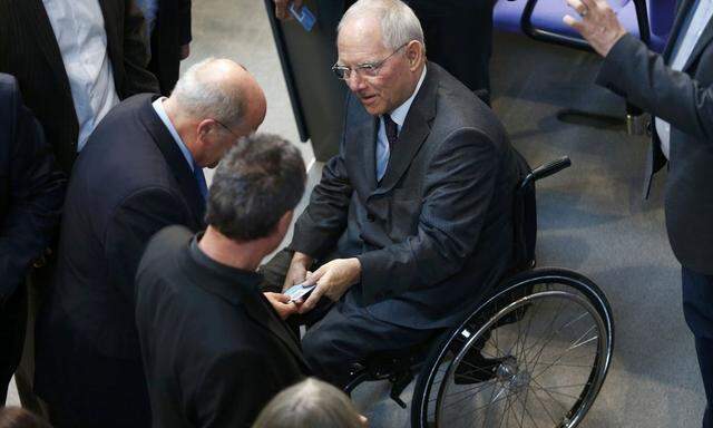 German Finance Minister Schaeuble and fellow deputies vote on approval to extend Greece's bailout during Bundestag session in Berlin