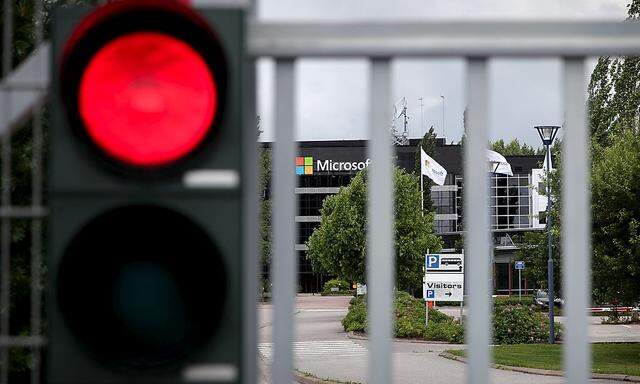 A Microsoft factory is seen behind a gate in Salo