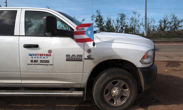 A pick up from Montana-based Whitefish Energy Holdings is parked as workers help fix the island´s power grid, damaged during Hurricane Maria in September, in Manati