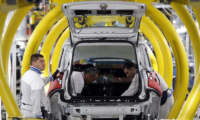 File photo of employees of Fiat SpA working on new  'Panda' car at the Fiat plant in Pomigliano D'Arco