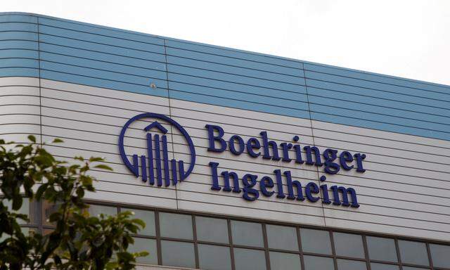 FILE PHOTO: The logo of German pharmaceutical company Boehringer Ingelheim is seen at its building in Shanghai, China February 1, 2019.  REUTERS/Stringer  ATTENTION EDITORS - THIS IMAGE WAS PROVIDED BY A THIRD PARTY. CHINA OUT./File Photo