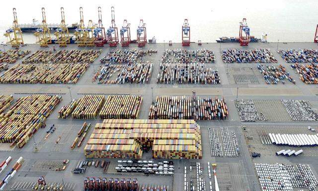 File photo of cars and containers at a shipping terminal in the harbour of the German northern town of Bremerhaven