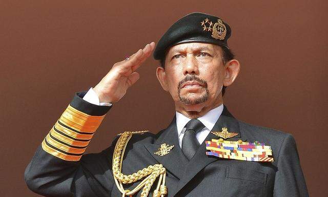 Brunei's Sultan Hassanal Bolkiah salutes during celebrations for Brunei's 30th National Day, in Bandar Seri Begawan