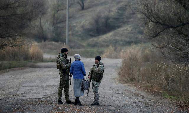 Servicemen patrol in the village of Katerynivka