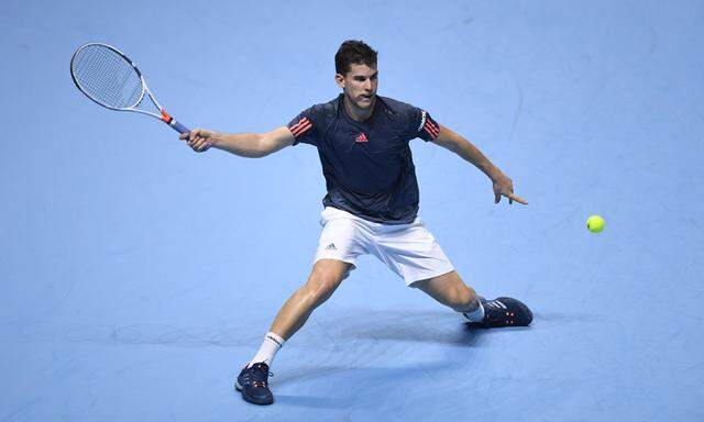 Austria´s Dominic Thiem in action against Serbia´s Novak Djokovic during their round robin match