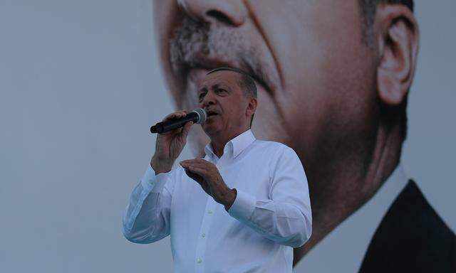 Turkish President Tayyip Erdogan addresses his supporters during an election rally in Ankara