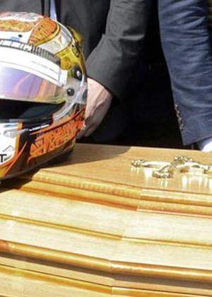 The helmet of late Marussia Formula One driver Jules Bianchi is placed on his coffin at the end of the funeral ceremony at the Sainte Reparate Cathedral in Nice