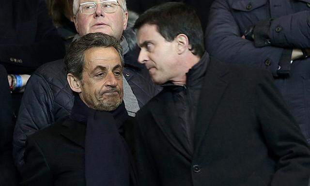 Former French President Sarkozy French Interior Minister Valls  and French Interior Minister Valls attend the French Ligue 1 soccer match between Paris Saint-Germain and Olympique Marseille at the Parc des Princes stadium in Paris
