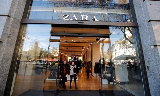 People leave a Zara store, an Inditex brand, in central Barcelona