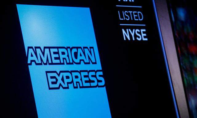 American Express logo and trading symbol are displayed on a screen at the NYSE in New York