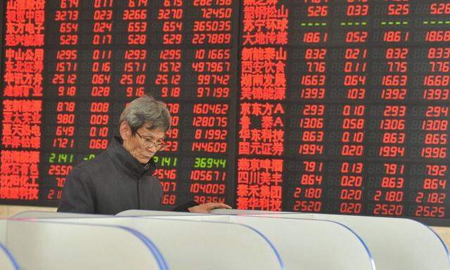 FUYANG CHINA JANUARY 06 CHINA OUT An investor observes stock market at an exchange hall on Jan