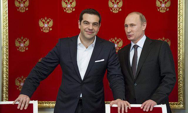 Russian President Putin and Greek Prime Minister Tsipras attend a signing ceremony at the Kremlin in Moscow