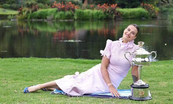 Aryna Sabalenka, BLR, presenting her trophy during a photoshoot in the botanical gardens after 2023 Australian Open in M