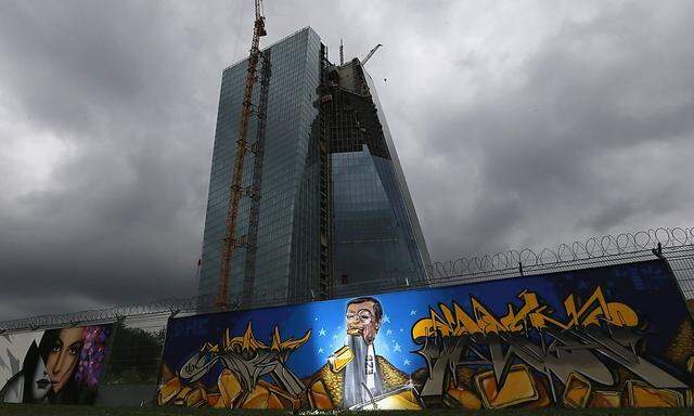 File photo of graffiti depicting ECB President Draghi on fence surrounding construction site for new headquarters of ECB in Frankfurt
