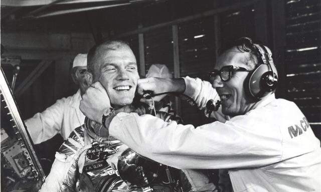 Guenter Wendt coaxes a smile out of astronaut John Glenn after the MA-6 mission was scrubbed in Cape Canaveral