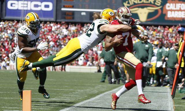 Green Bay Packers Clay Matthews commits a late hit on San Francisco 49ers Colin Kaepernick during their NFL season home opener football game in San Francisco