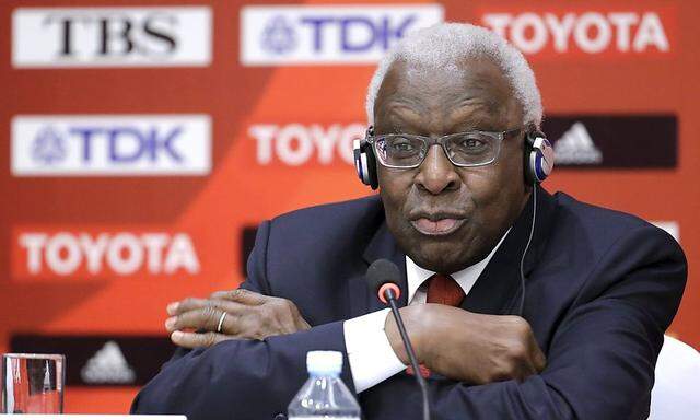File photo of then-outgoing President of IAAF Diack attending a news conference in Beijing