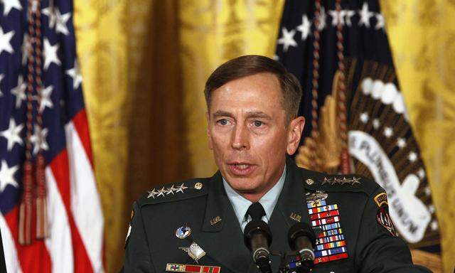 File photo of U.S. Army Gen. Petraeus and U.S. President Obama at event in the East Room of the White House