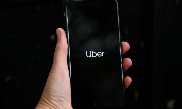 FILE PHOTO: FILE PHOTO: Uber's logo is displayed on a mobile phone in London, Britain