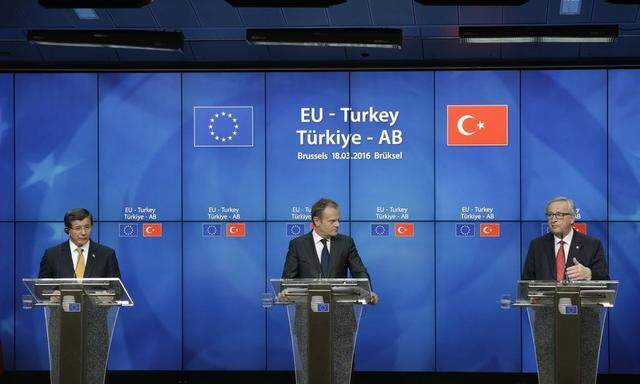 Turkish Prime Minister Ahmet Davutoglu European Council President Donald Tusk and European Commissi
