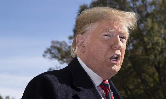 President Donald Trump delivers brief remarks to members of the news media before departing with first lady Melania Tru