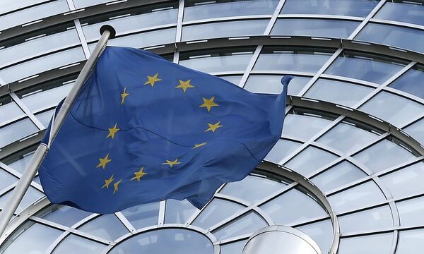 An European Union flag flutters outside of the European Parliament in Brussels
