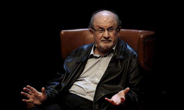 Author Rushdie gestures during a news conference before the presentation of his latest book ´Two Years Eight Months and Twenty-Eight Nights´ at the Niemeyer Center in Aviles
