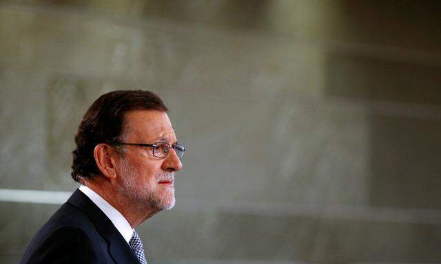 Spain´s acting Prime Minister Rajoy gestures during a news conference  at Moncloa Palace in Madrid