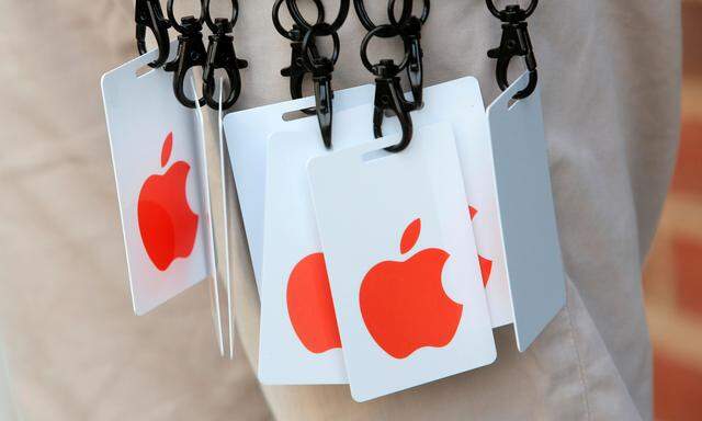 Visitor passes are held during a preview event at the new Apple Store Williamsburg in Brooklyn, New York