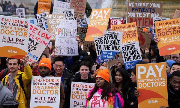 Junior doctors hold a strike amid a dispute with the government over pay, in London