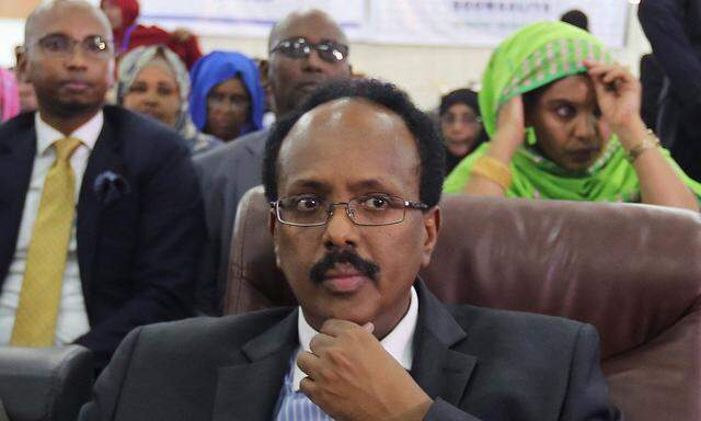 Somali Presidential candidate Minister Mohamed Abdullahi Farmajo follows the proceedings as lawmakers cast their ballot during the presidential vote at the airport in Somalia's capital Mogadishu