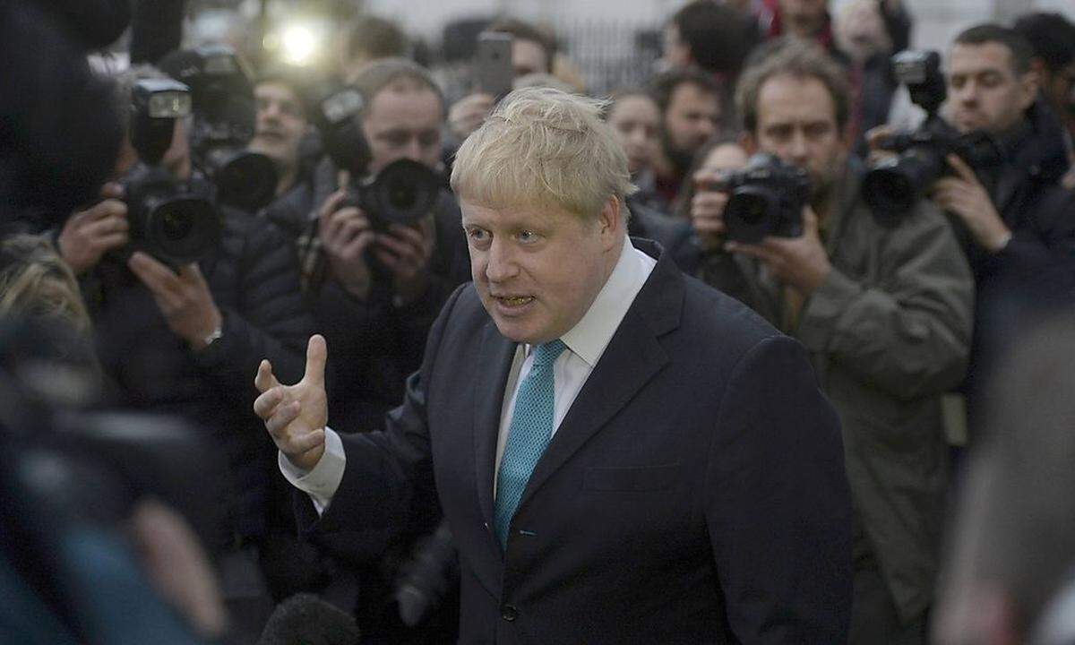 London Mayor Boris Johnson speaks to the media in front of his home in London