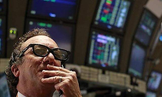 A trader wears RealD 3-D glasses on the floor of the New York Stock Exchange