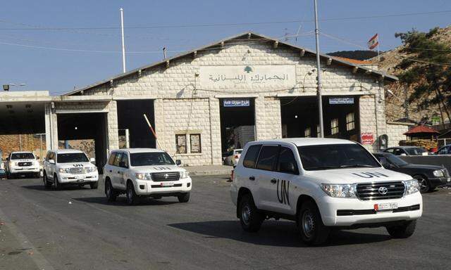 A convoy of vehicles carrying United Nations inspectors leaves the Masna'a border crossing between Lebanon and Syria in eastern Bekaa region of Lebanon
