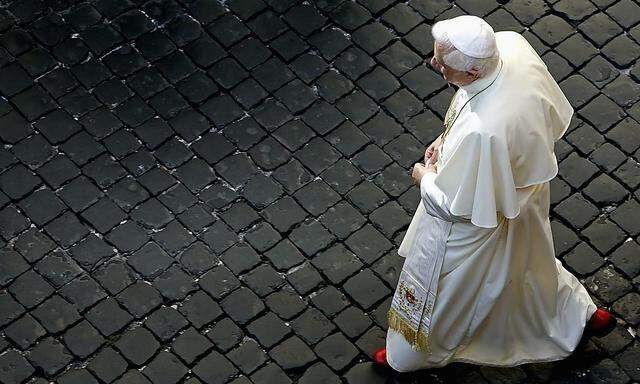 File picture of Pope Benedict XVI walking at the Vatican