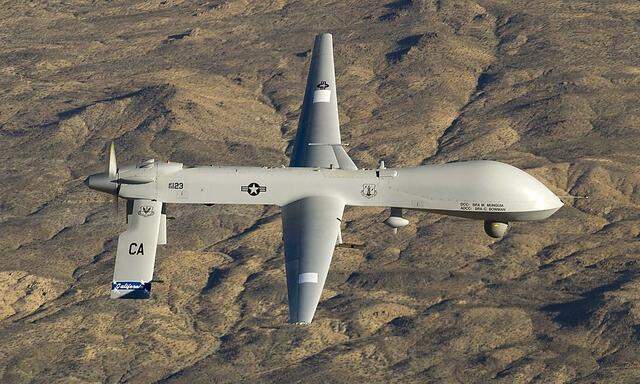 A U.S. Air Force MQ-1 Predator unmanned aerial vehicle flies near Victorville, California in this USAF handout photo
