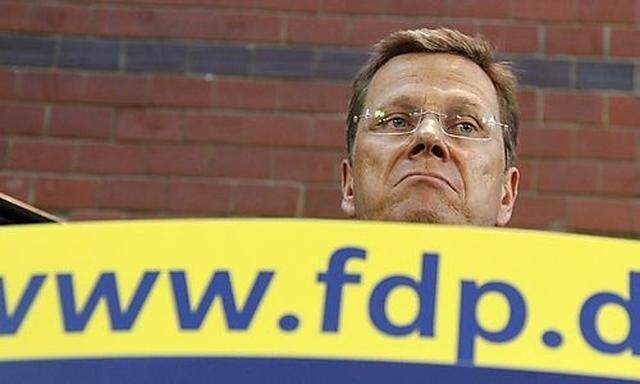 Leader of FDP and German Foreign Minister Westerwelle addresses news conference following a party mee