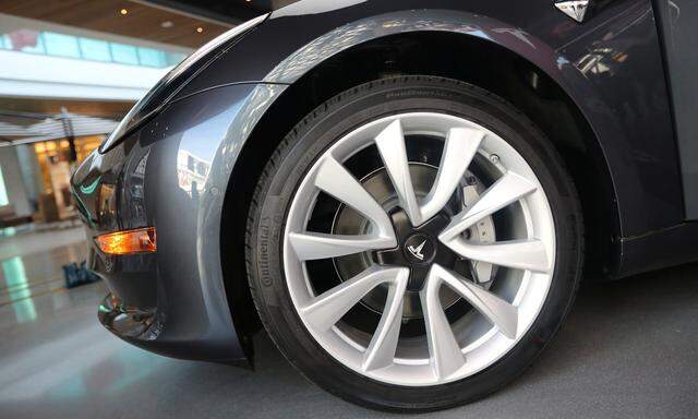 A Tesla Model 3 is seen in a showroom in Los Angeles