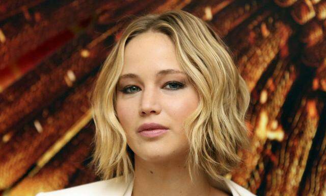 Actress Jennifer Lawrence attends the photocall for the film ´The Hunger Games: Mockingjay Part 1´ in London