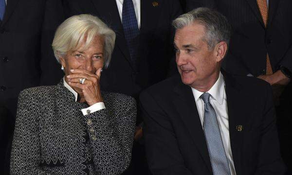 EZB-Chefin Christine Lagarde und Fed-Chef Jerome Powell werden heuer die Zinswende einleiten. Doch wer ist zuerst dran?