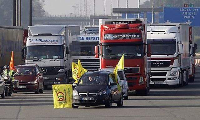 French striking truck drivers demonstrate on a motorway near Fresnes-les-Montauban