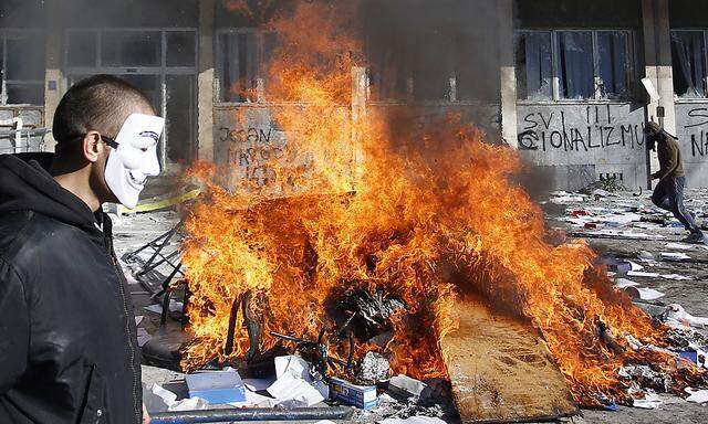 Protesters burn documents from a government building in Tuzla