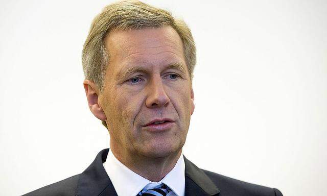 Former German President Christian Wulff arrives for the trial at the regional court in Hanover