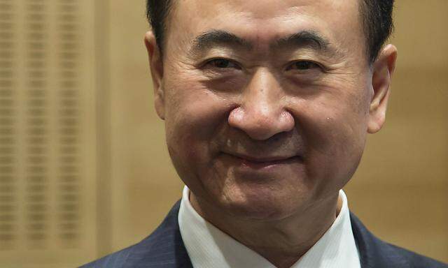 File photo shows Wang Jianlin, chairman of Wanda commercial properties, attending a ceremony during the debut of the company at the Hong Kong Stock Exchange