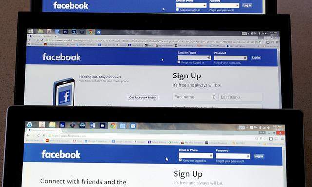 Computer screens display the Facebook sign-in screen in this photo illustration taken in Golden