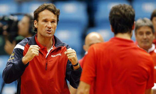 Spain's team captain Carlos Moya reacts after Pablo Andujar of Spain won a game against Thomaz Bellucci of Brazi during their Davis Cup play-off tennis match in Sao Paulo