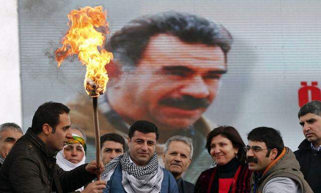 Demirtas, co-chairman of the pro-Kurdish Peace and Democracy Party, lights a traditional Newroz fire during a rally to celebrate the spring festival of Newroz in Istanbul