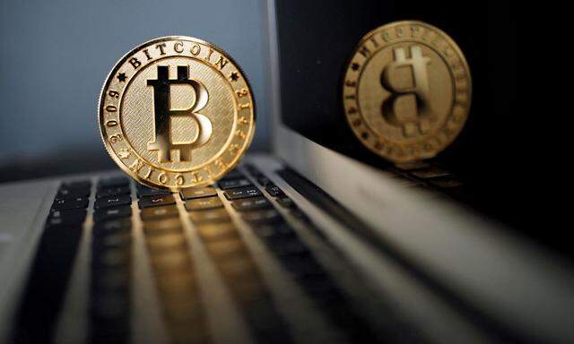 FILE PHOTO: A bitcoin representation is seen in an illustration picture taken at La Maison du Bitcoin in Paris